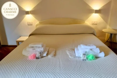  Letto matrimoniale con kit asciugamani
